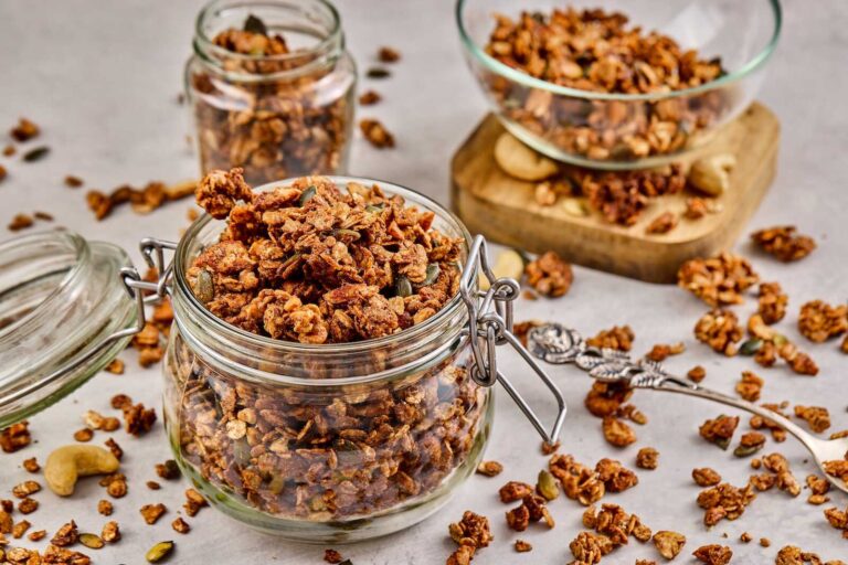 High protein homemade granola stored in a glass jar.